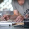 Close-up set of wood drills on a blurred background.